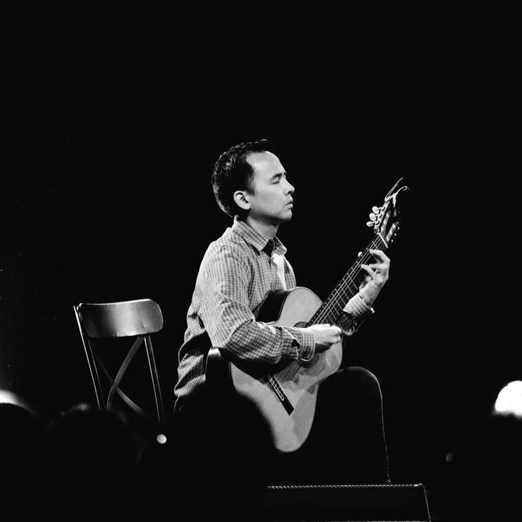 Ramon Fermin playing guitar
