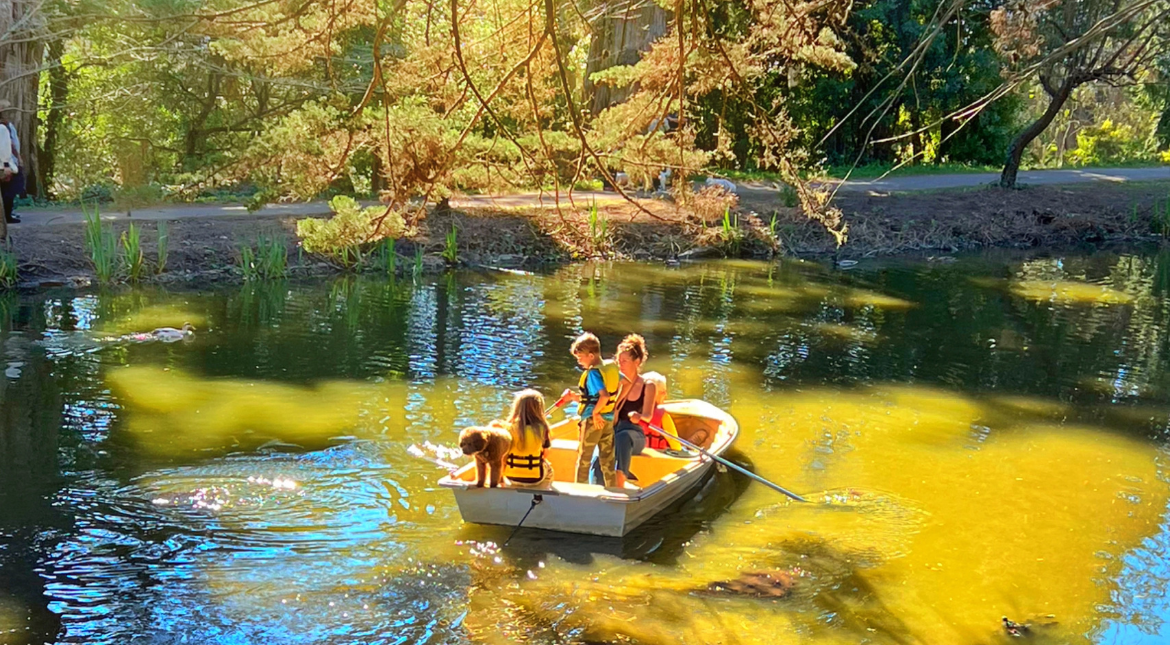 Family on a boat on Stow Lake